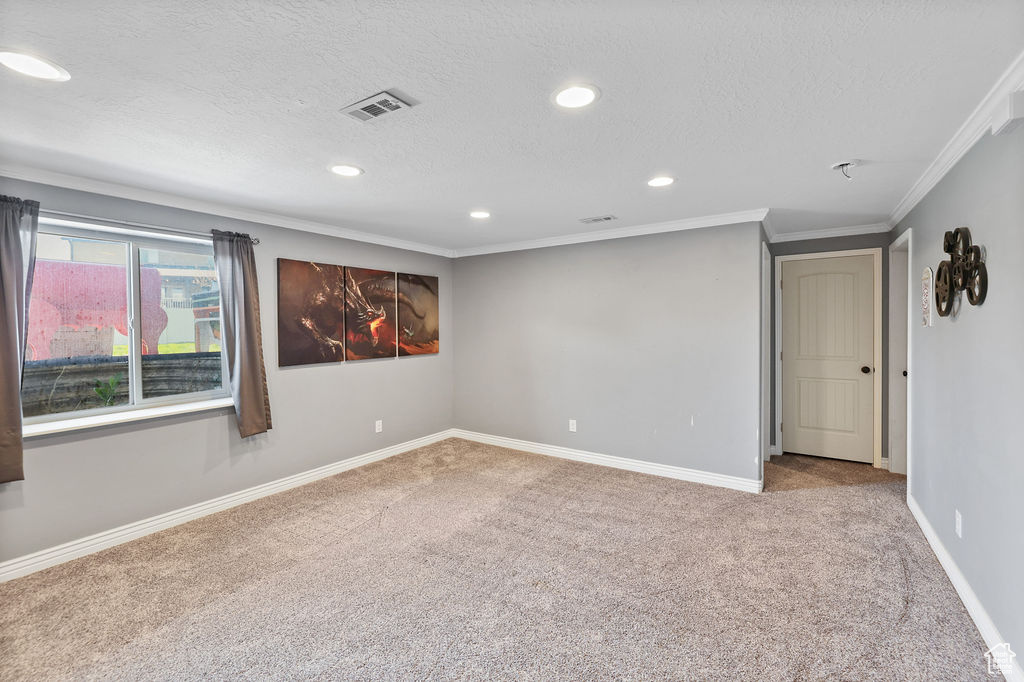 Unfurnished room featuring recessed lighting, carpet, and a textured ceiling