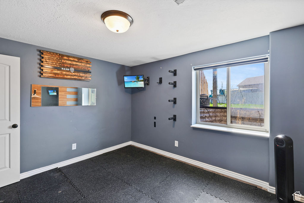 Unfurnished room featuring baseboards