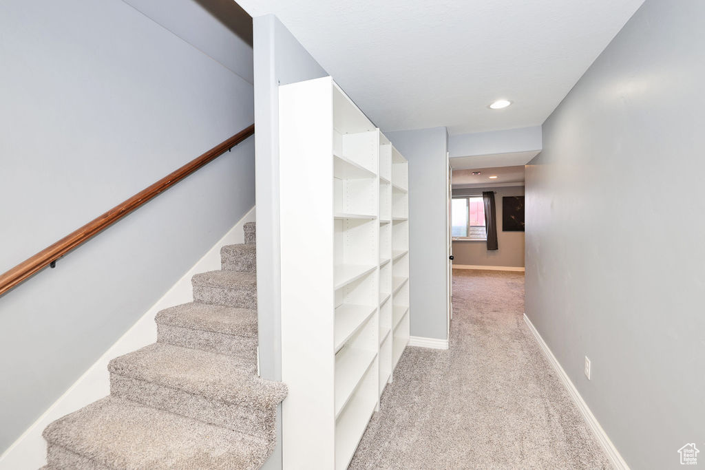 Stairs featuring recessed lighting, carpet floors, and baseboards