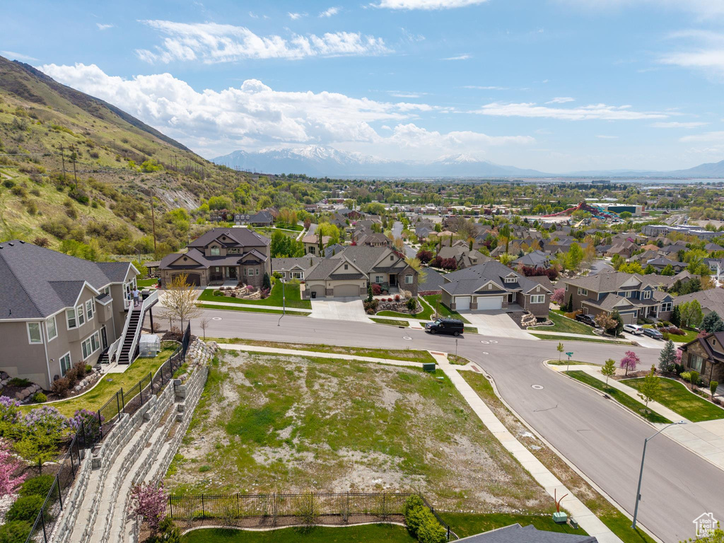 Drone / aerial view with a residential view and a mountain view