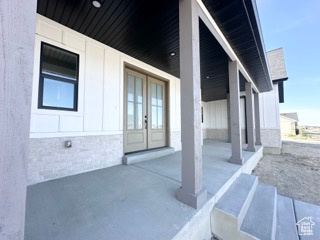 View of patio / terrace with covered porch and french doors