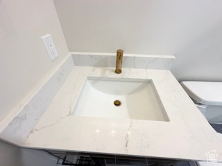 Room details with toilet and vanity