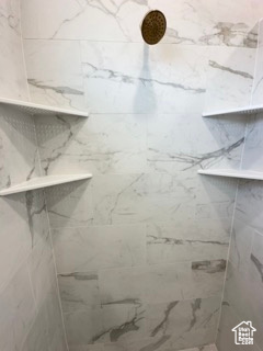 Bathroom with a marble finish shower