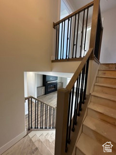 Stairway featuring baseboards