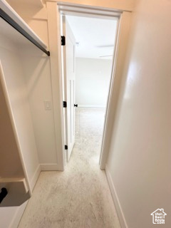 Hallway featuring baseboards