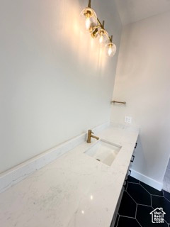 Bathroom with vanity and baseboards