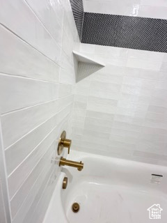 Room details featuring bathtub / shower combination