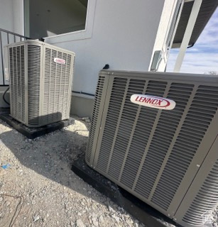 Exterior details featuring stucco siding and central air condition unit