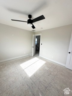 Unfurnished bedroom with baseboards, a ceiling fan, and carpet