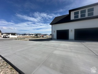 View of home's exterior featuring driveway and a garage