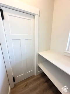 Mudroom featuring dark wood-style floors