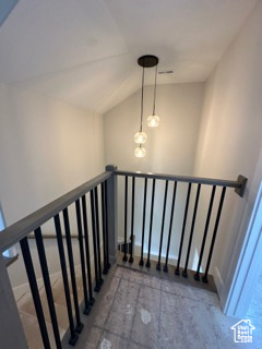 Staircase with lofted ceiling