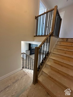 Stairway featuring baseboards