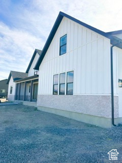 View of property exterior with board and batten siding