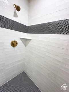 Full bath with tiled shower