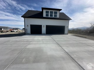 Garage with concrete driveway
