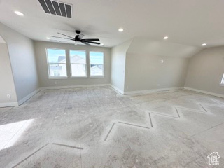 Interior space featuring recessed lighting, visible vents, lofted ceiling, and baseboards