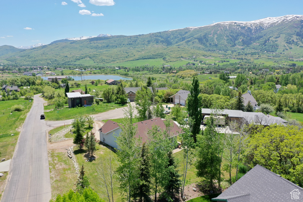 Drone / aerial view with a water and mountain view