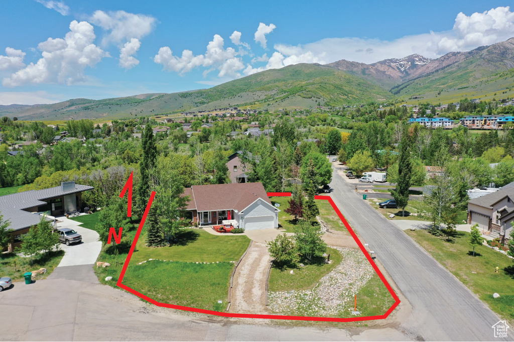 Birds eye view of property featuring a mountain view
