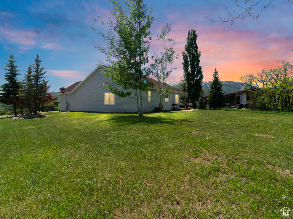 View of yard at dusk