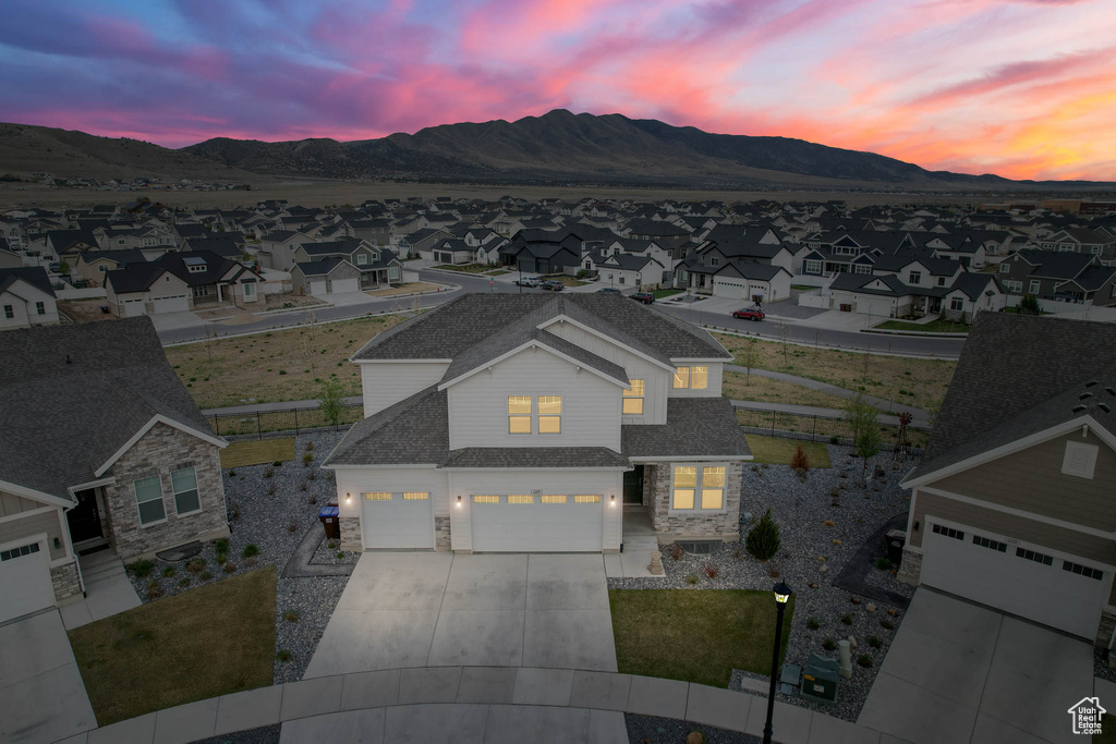 Aerial view at dusk of a residential view and a mountain view
