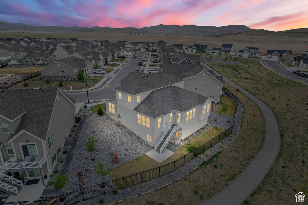 Aerial view at dusk of a mountain view and a residential view