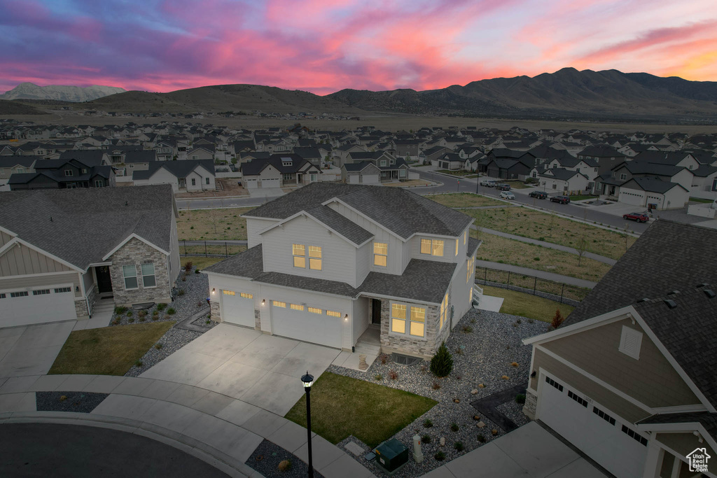 Aerial perspective of suburban area with a mountain backdrop