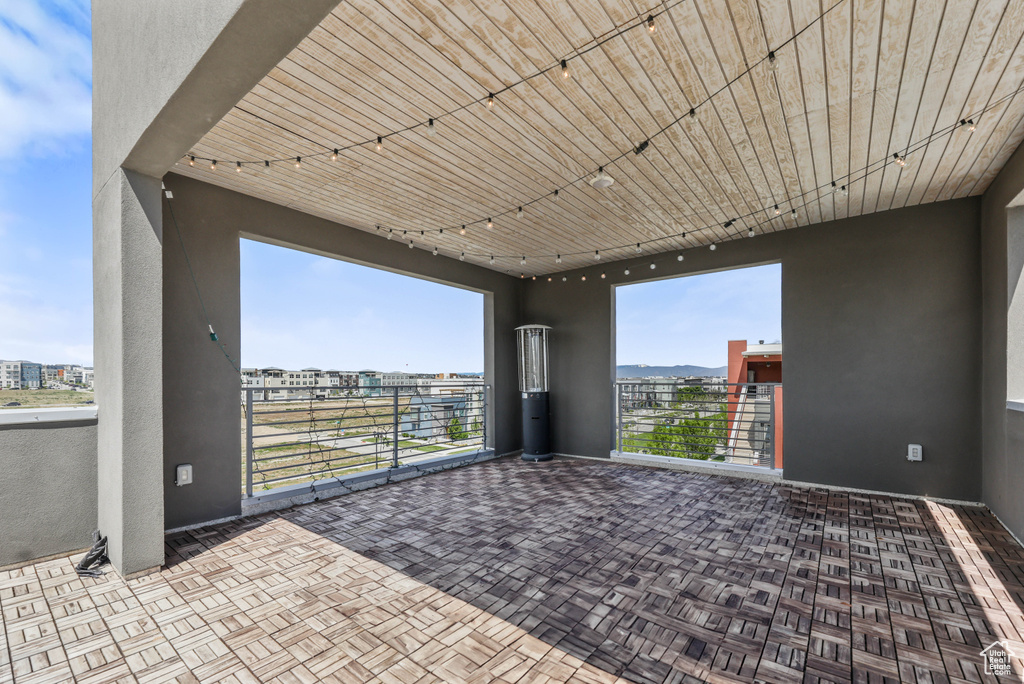 View of patio featuring a balcony