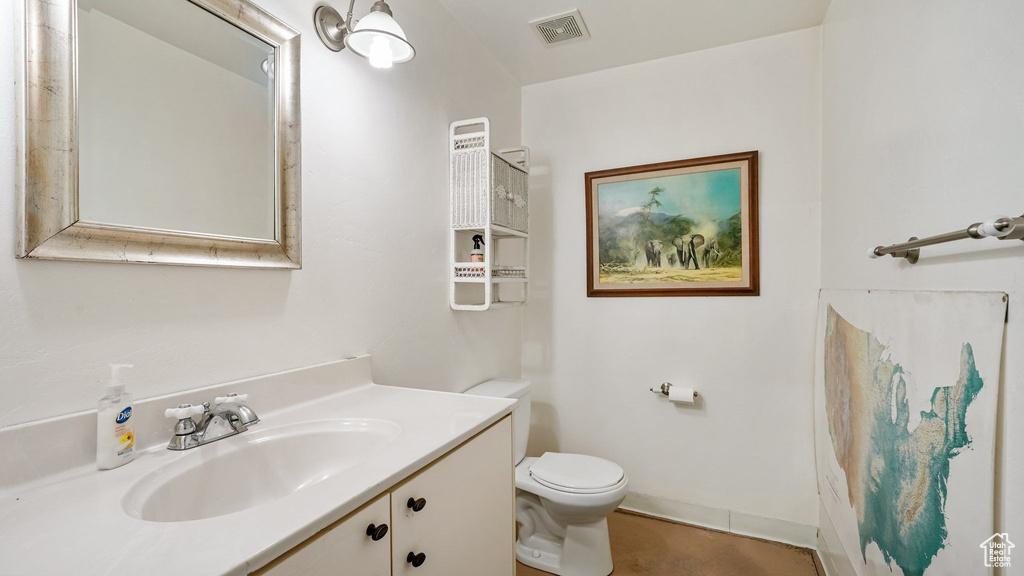 Bathroom with vanity and toilet