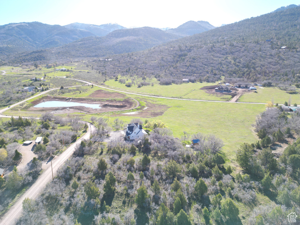 Aerial view featuring a rural view and a mountain view