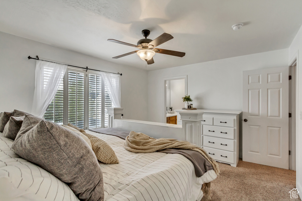 Bedroom with light carpet and ceiling fan