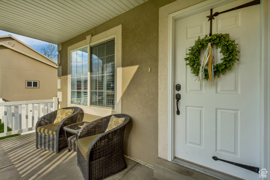 View of exterior entry featuring stucco siding