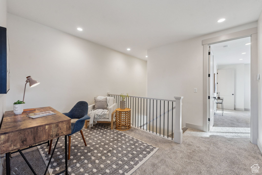 Carpeted office with baseboards and recessed lighting