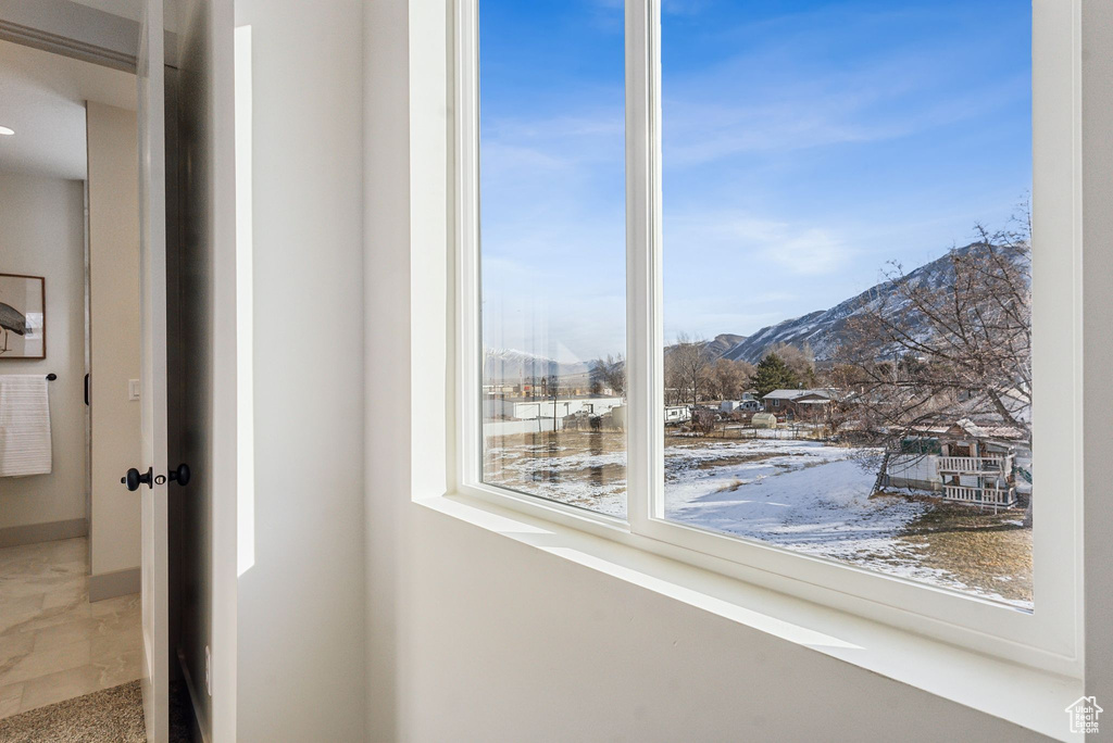 Interior space with a mountain view and baseboards
