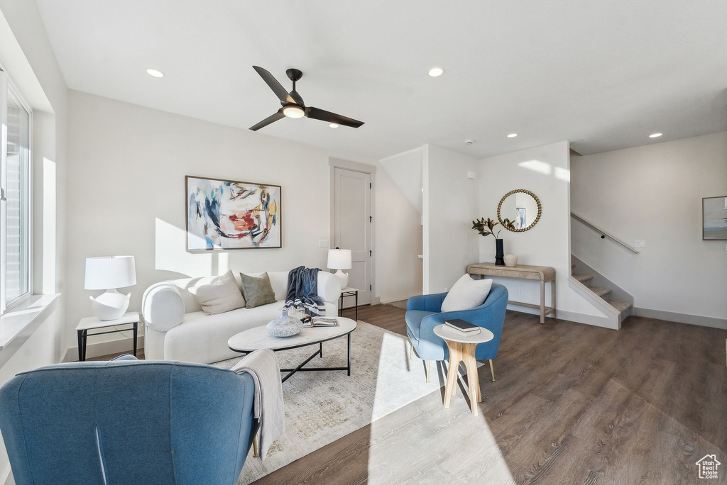 Living area with stairway, wood finished floors, ceiling fan, and recessed lighting