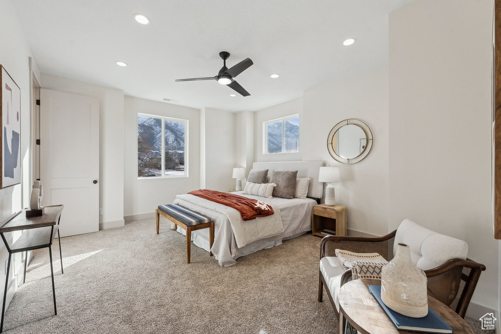 Carpeted bedroom with baseboards, recessed lighting, and a ceiling fan