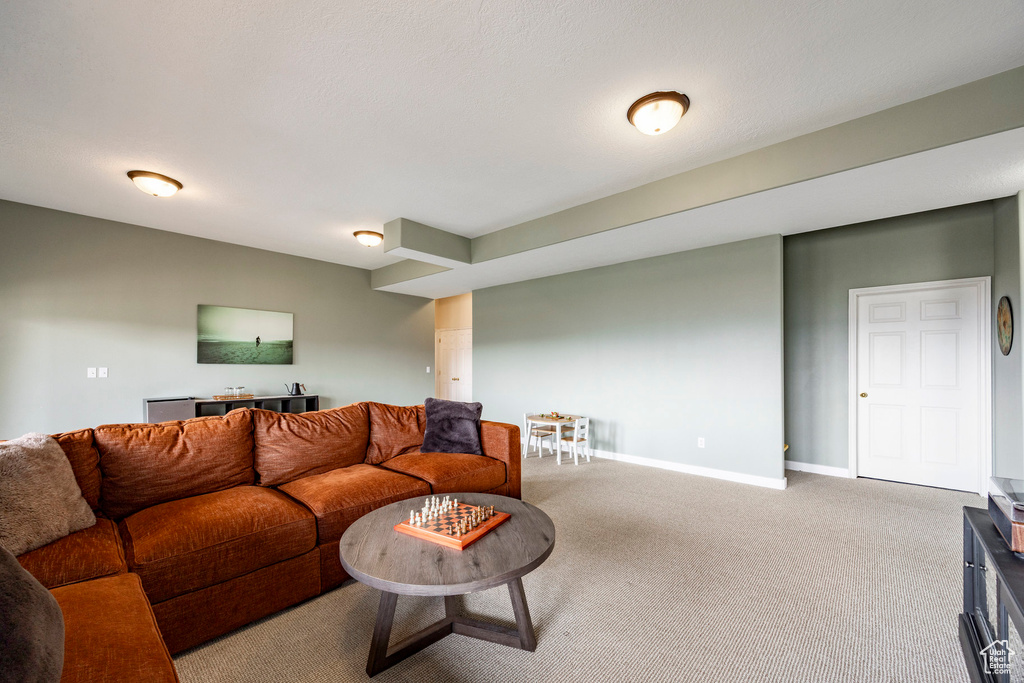 Living room with carpet flooring and baseboards