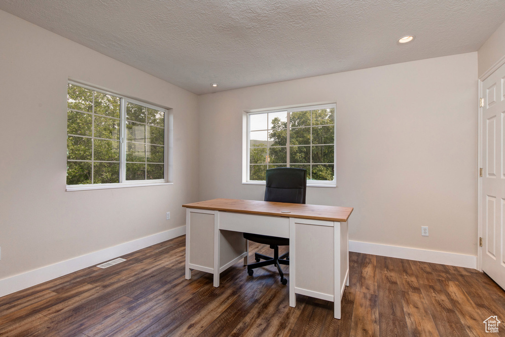 Office with baseboards, dark wood-style flooring, recessed lighting, and a textured ceiling