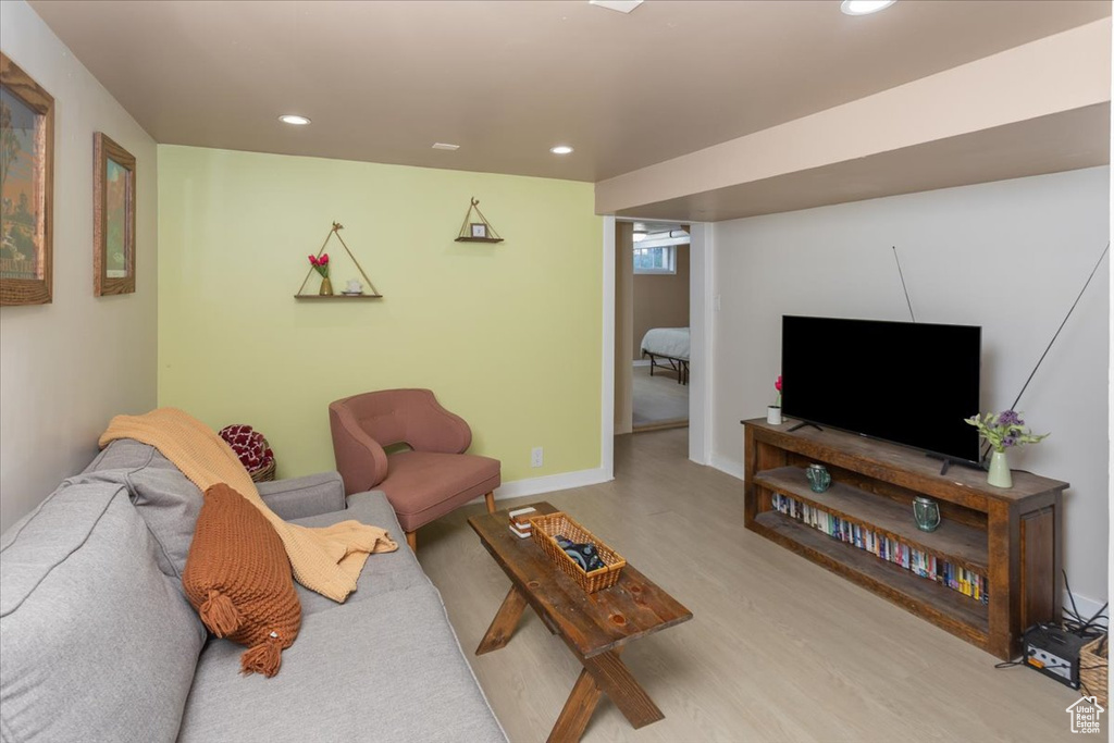 Living area featuring recessed lighting, wood finished floors, and baseboards