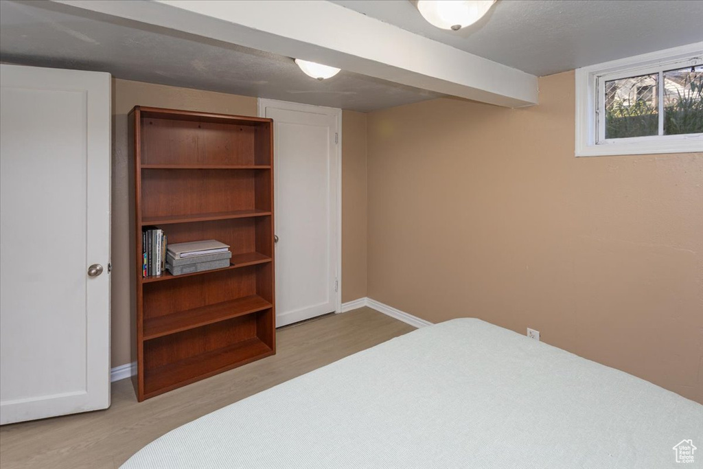 Bedroom featuring baseboards and light wood-style floors