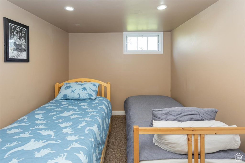 Bedroom featuring recessed lighting, carpet, and baseboards