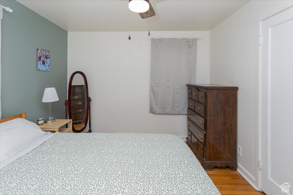 Bedroom featuring light wood finished floors and a ceiling fan