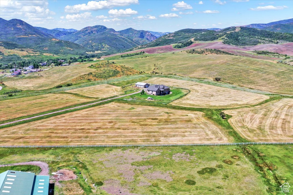 Aerial view featuring a rural view and a mountain view