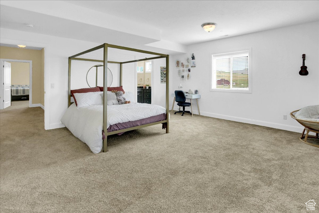 Carpeted bedroom with baseboards