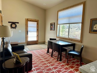 Interior space with light carpet and baseboards