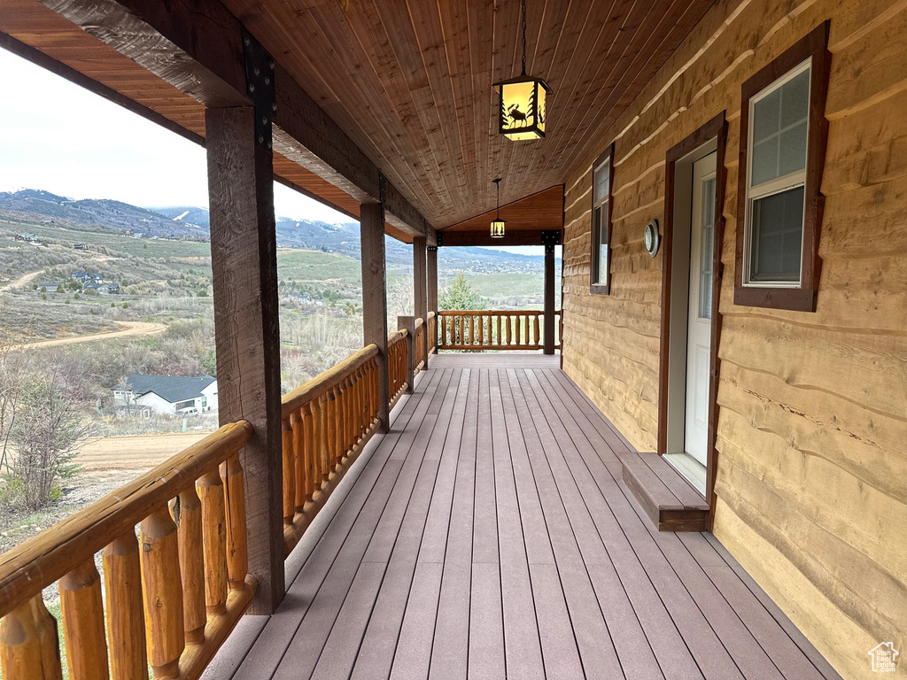 Wooden terrace with a porch and a mountain view