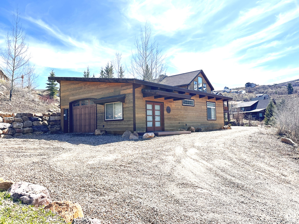Exterior space with driveway and french doors