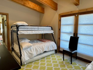 Bedroom with beamed ceiling