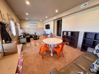 Interior space featuring recessed lighting and visible vents