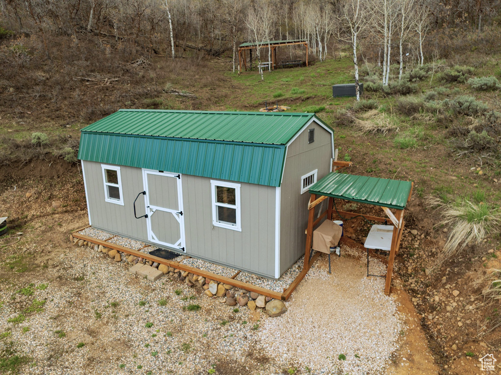 View of outbuilding with an outdoor structure